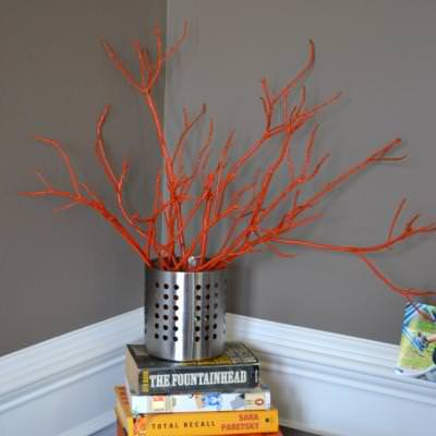 painted sticks in a vase